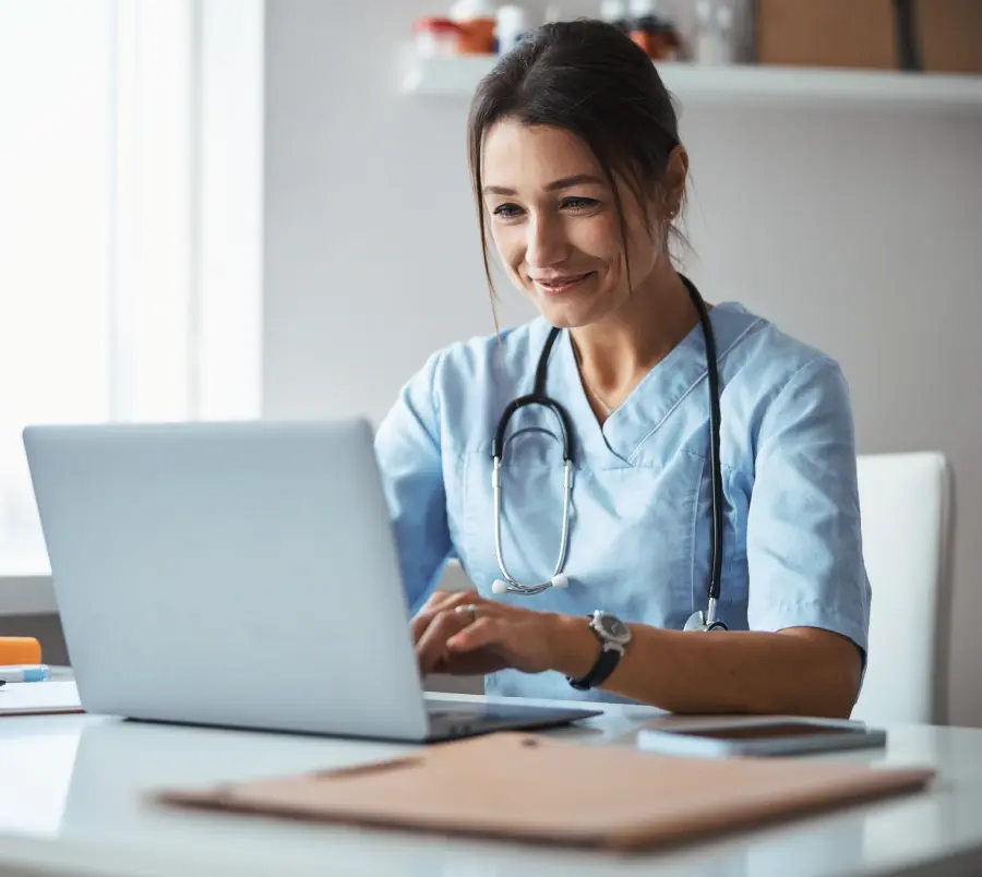 Nurse practitioner using her laptop